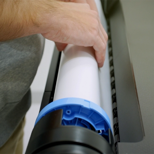 Installing paper roll in a poster printer machine for setup