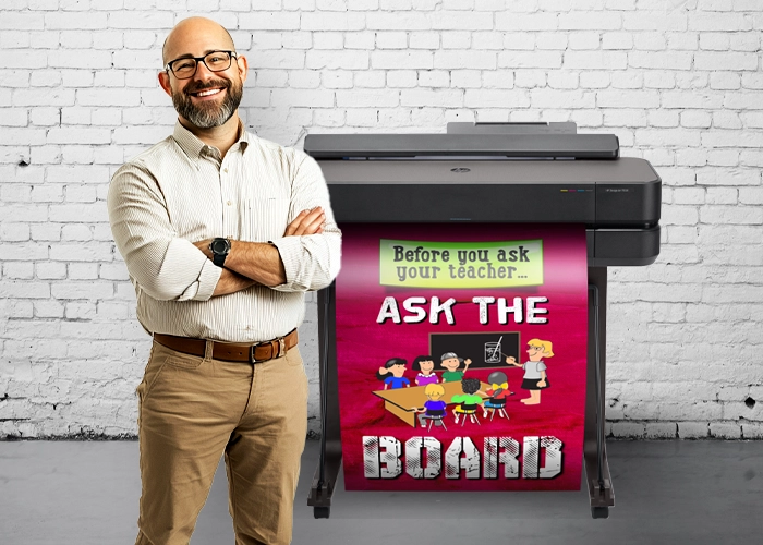 Poster Maker Printing Poster Teacher operating a poster printer for schools