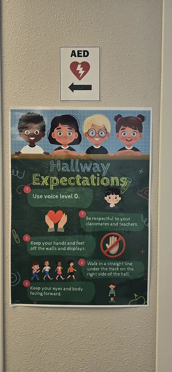 Hallway Expectations poster with five illustrated hallway rules at Steve and Linda Cozine Elementary School