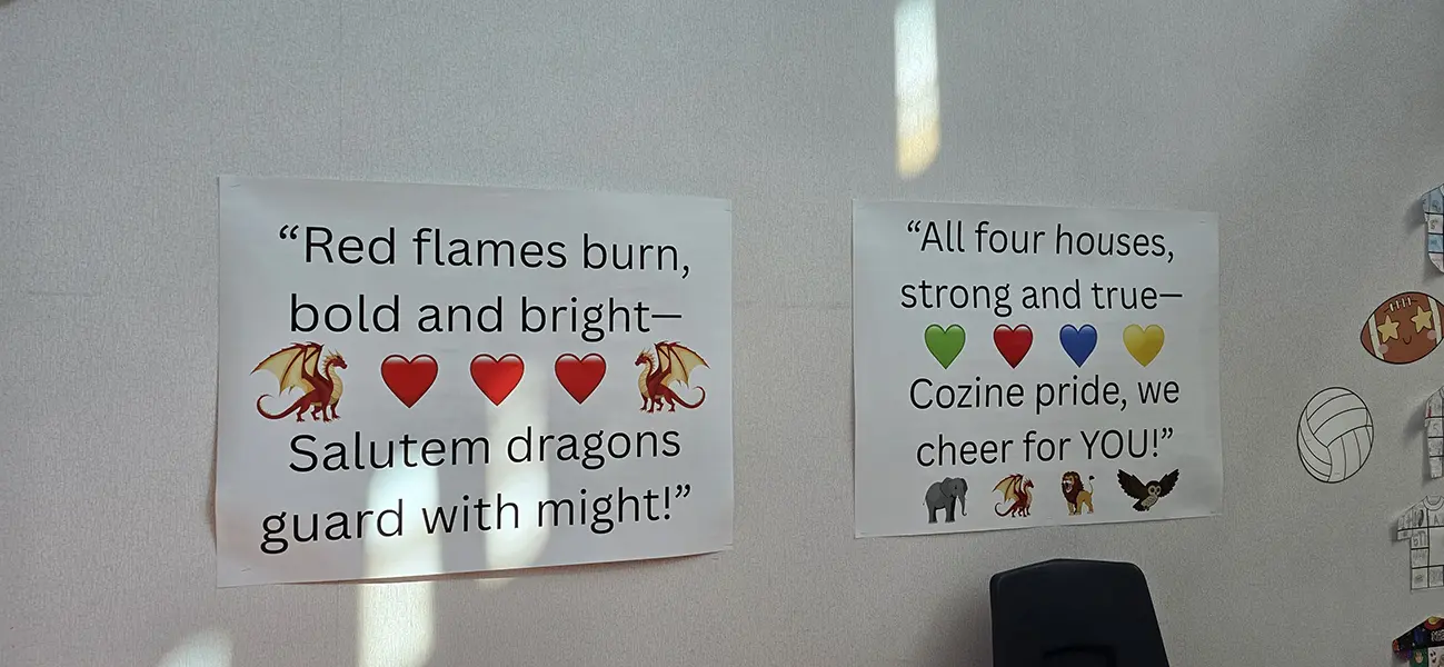 House pride chant posters with dragon, lion, elephant and owl mascots at Steve and Linda Cozine Elementary School